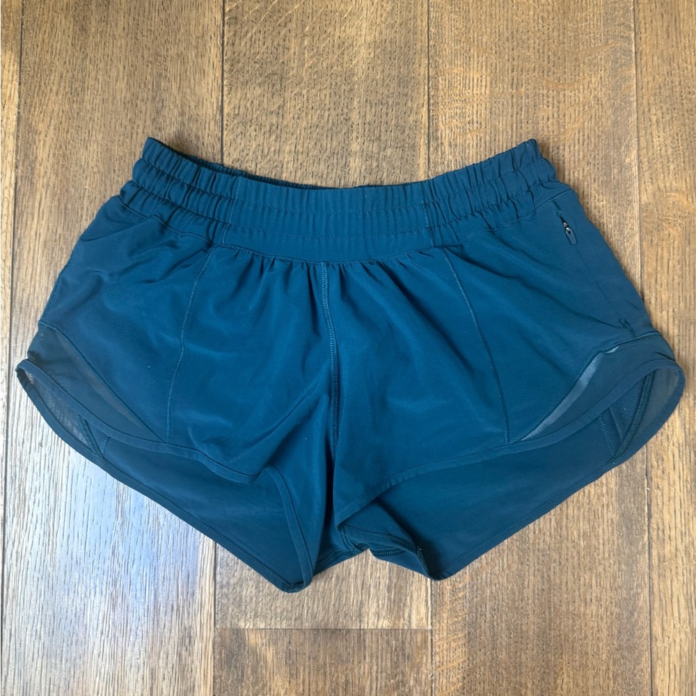 lululemon hottie hot 2.5 inch shorts.  
Size 4 teal color Excellent